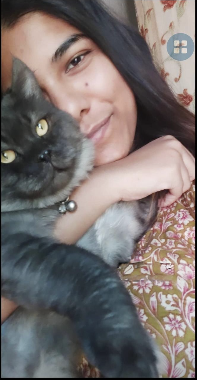 Mehak cuddling Leo, her late cat